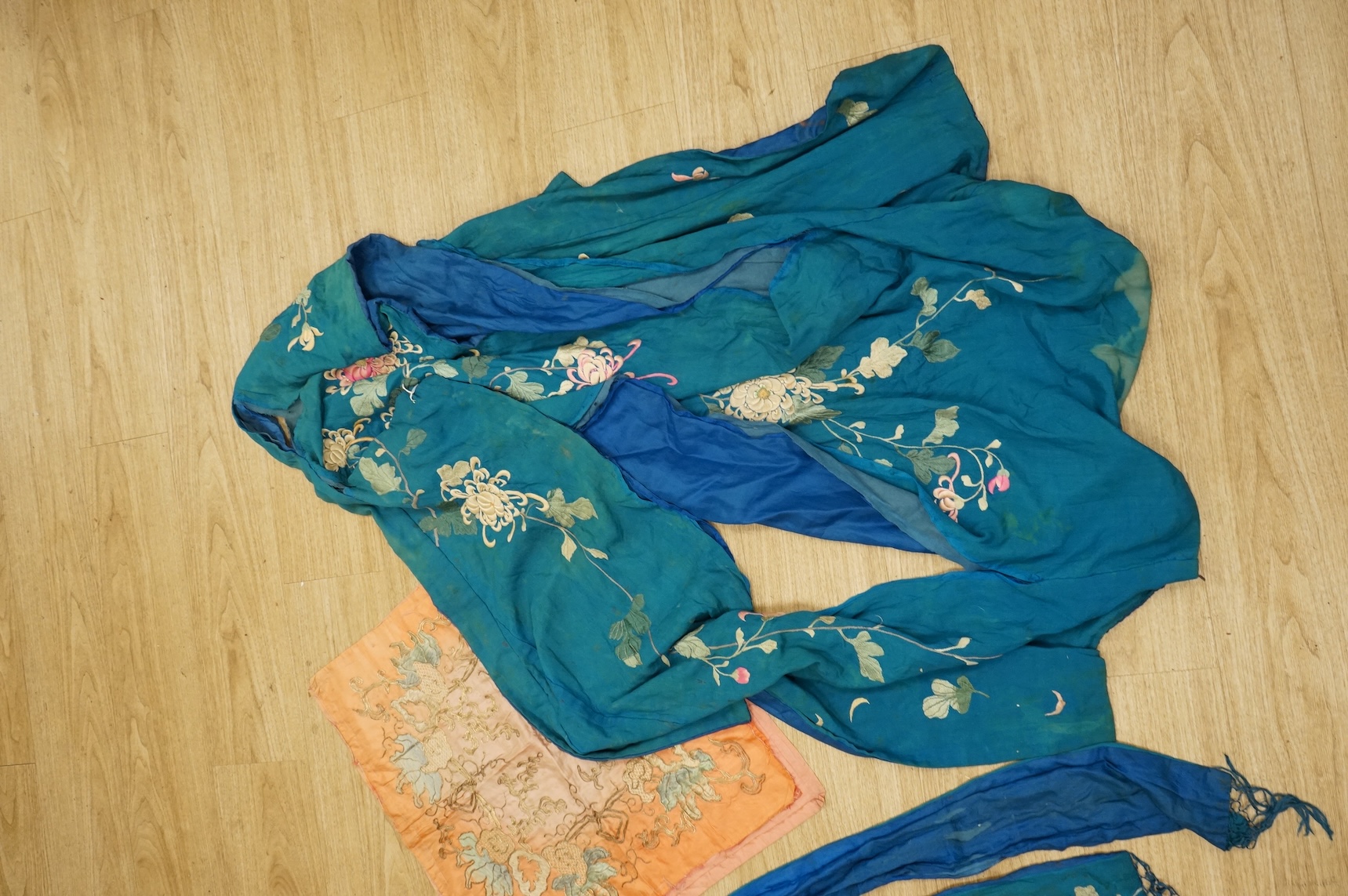 A collection of Chinese and Japanese embroidered kimonos and textiles